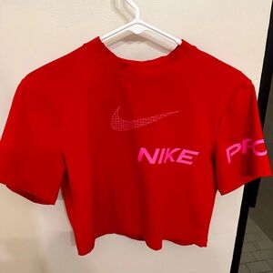 Nike Pro Dri-FIT Crop T-Shirt in University Red/Pinksicle